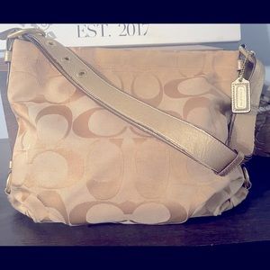 Tan with gold accents Coach shoulder bag